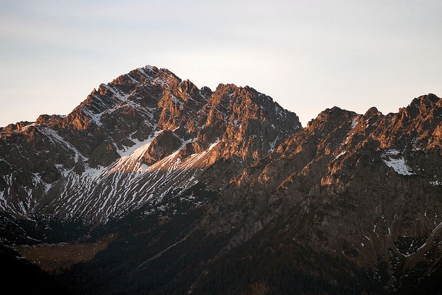 landscape photography of brown and white mountains, ridge, sunlight