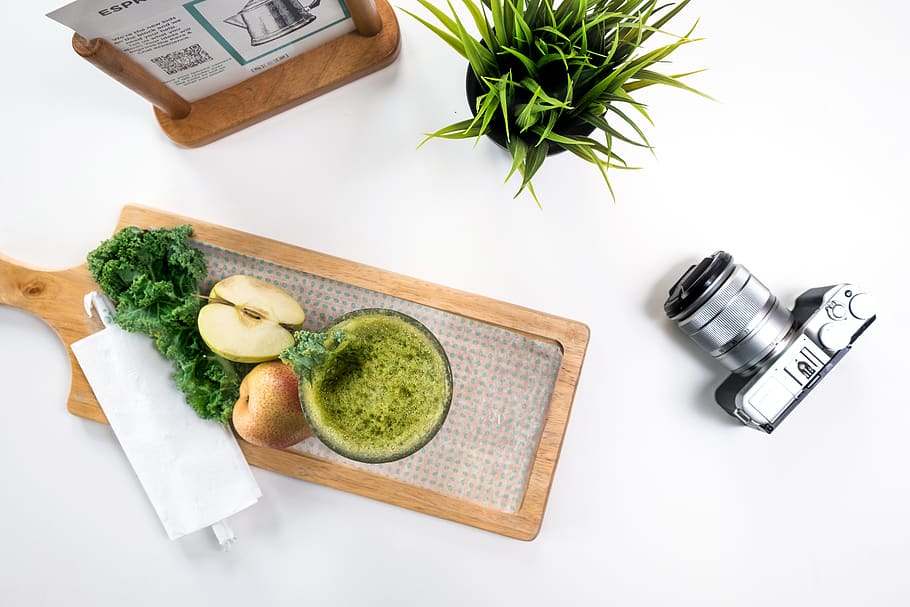 Black And Grey Mirrorless Camera Near Brown Chopping Board With Vegetables On Top HD wallpaper