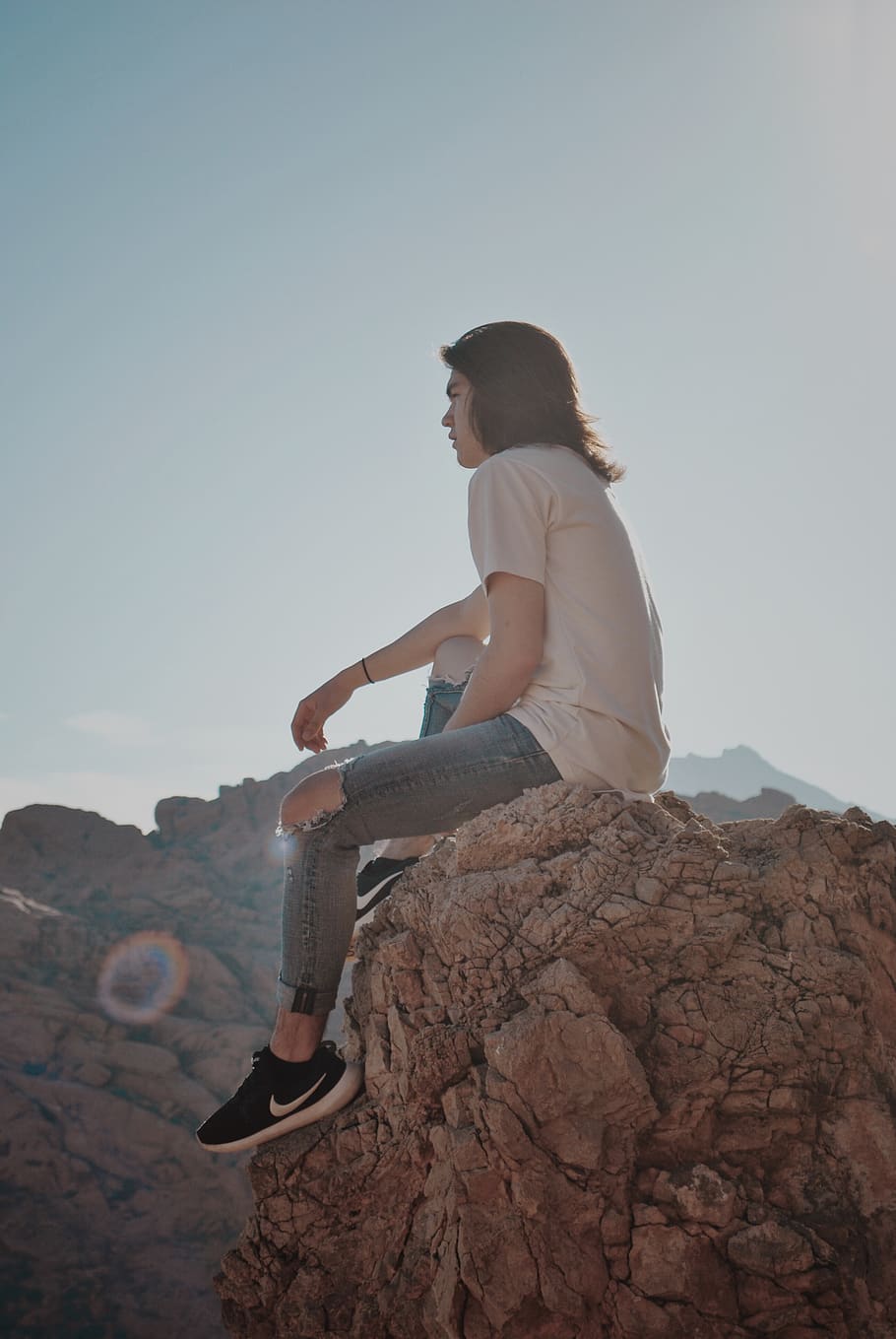 man sitting on rock, sky, rock - object, solid, one person, real people HD wallpaper