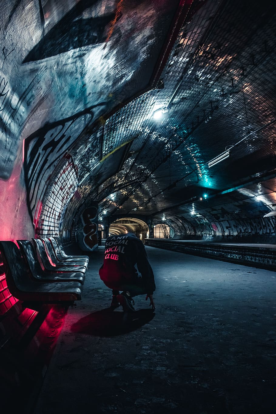 Man Sitting at Tunnel, architecture, blue and red, dark, evening