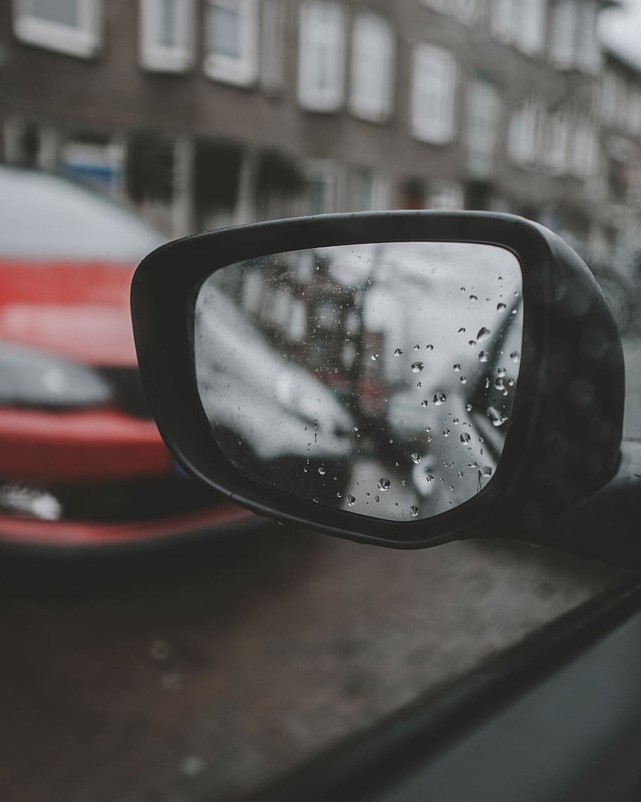 selective focus photography of vehicle side mirror, the hague