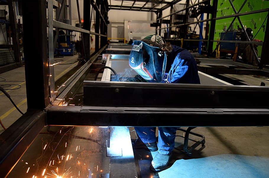 person welding metal, indoors, industry, factory, real people HD wallpaper