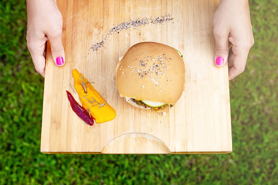 hamburger on chopping board, human hand, human body part, one person HD wallpaper
