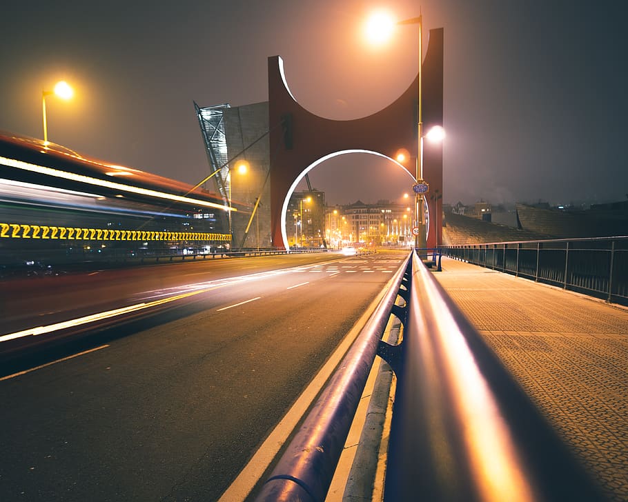 concrete bridge at nighttime, illuminated, long exposure, light trail HD wallpaper