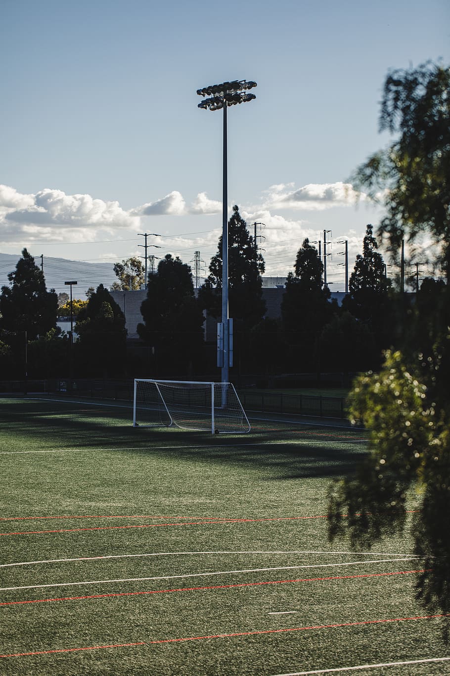 white soccer field post lights during daytime, team sport, sports