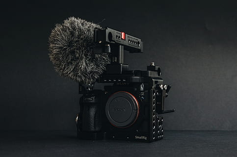 black Sony camera near wall, electronics, digital camera, video camera HD wallpaper
