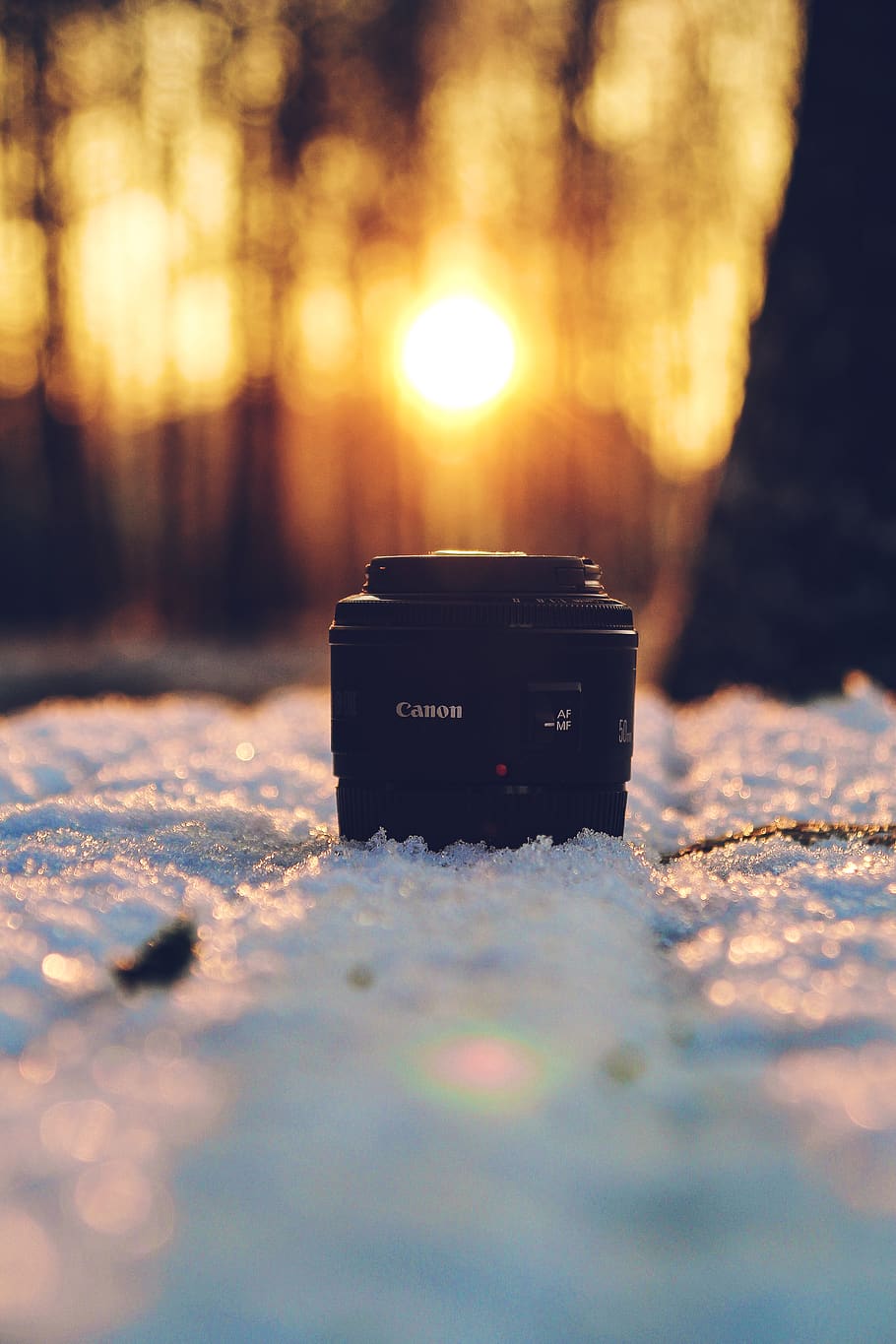 black Canon DSLR camera lens on snow, electronics, photography