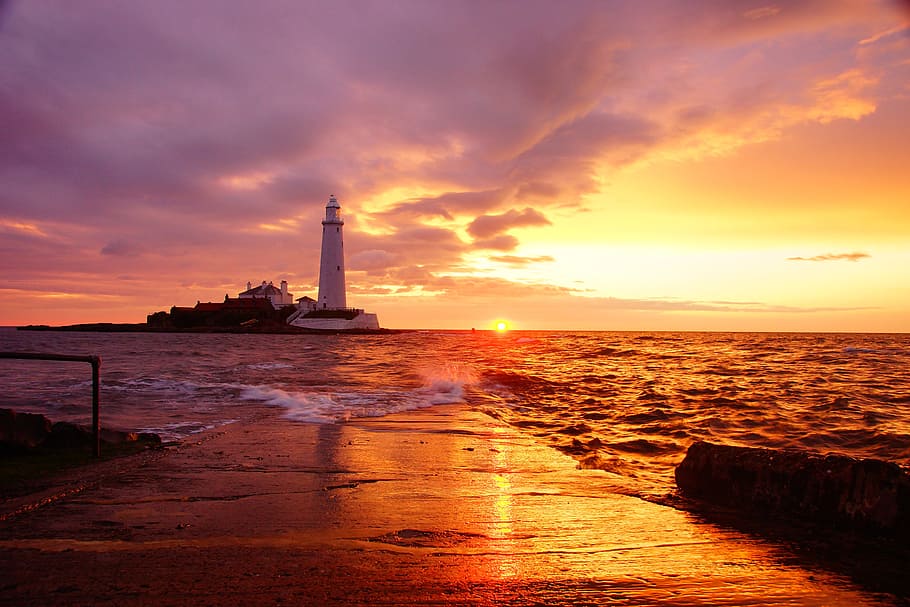 Lighthouse During Sunset, clouds, dawn, dusk, nature, ocean, sea HD wallpaper