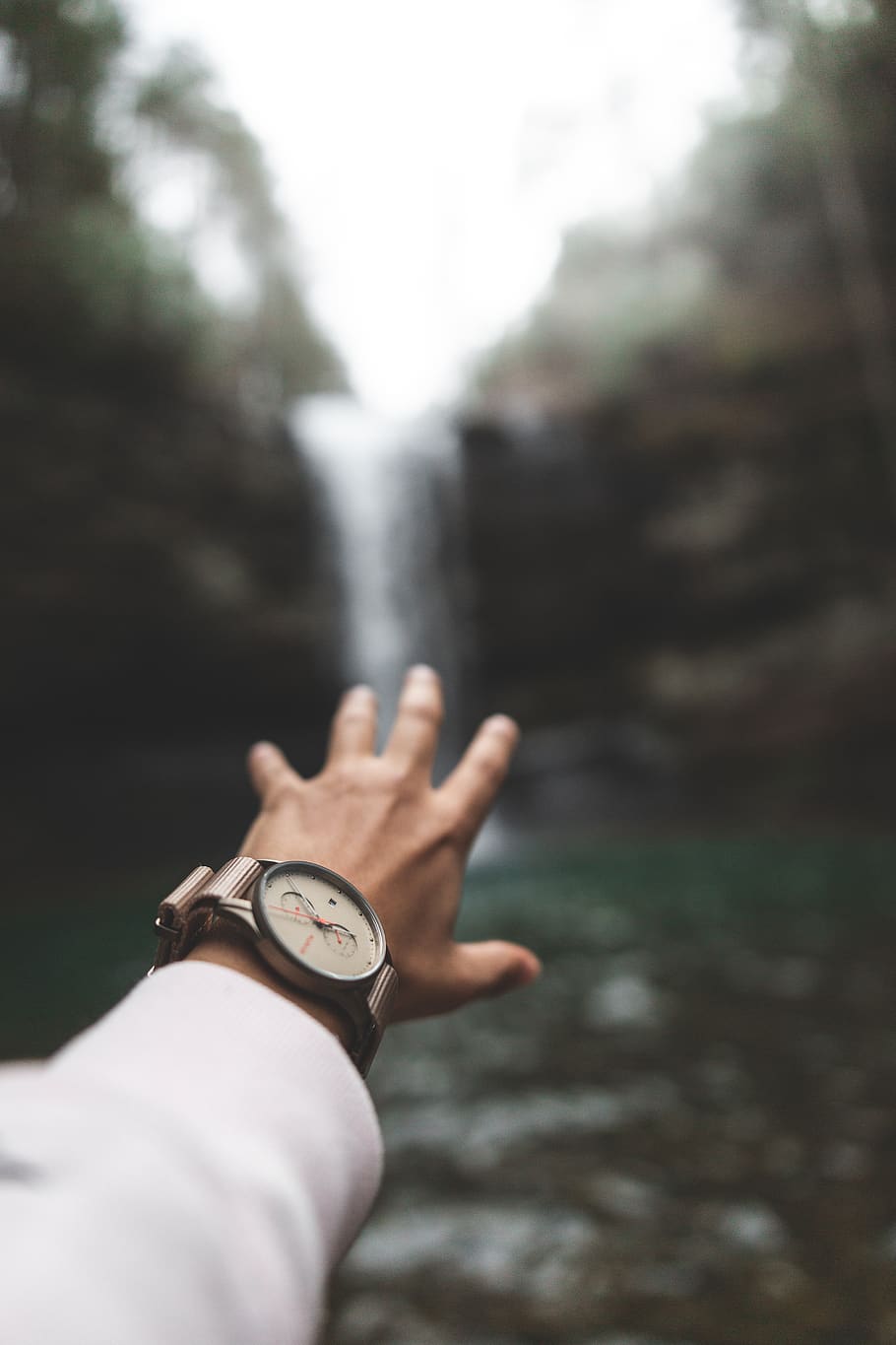selective focus photography of man reaching out to waterfalls, HD wallpaper