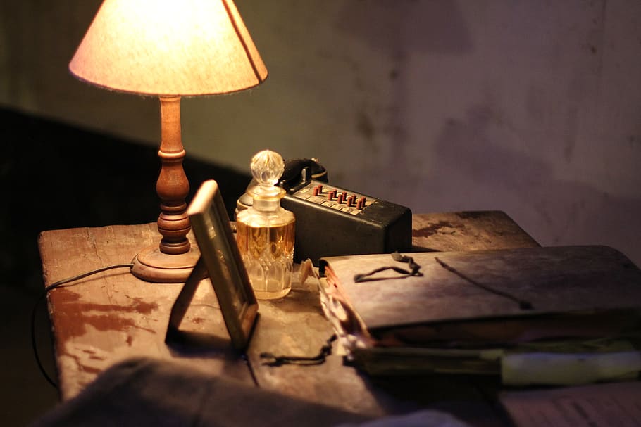 Classic still life with vintage books placed with illuminated