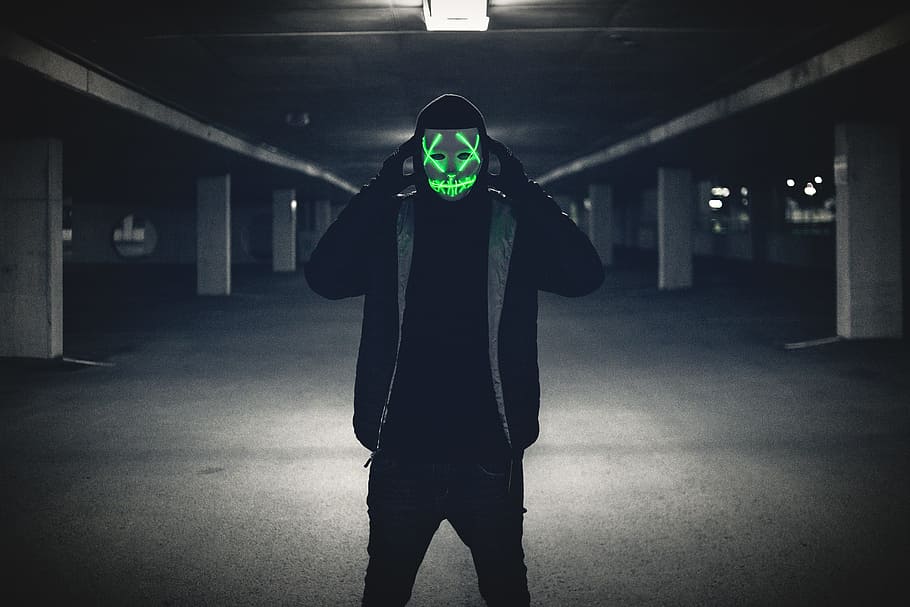 man wearing black jacket and red LED mask, spooky, glow, portrait