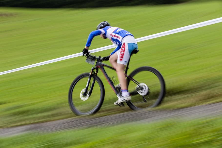Man in Blue and White Long Sleeve Sweat Shirt Riding Black Hard Tail Bicycle HD wallpaper