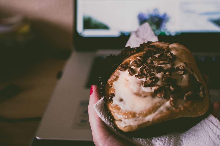 Person Holding Chocolate-topped Cupcake With Cinnamon, bread HD wallpaper
