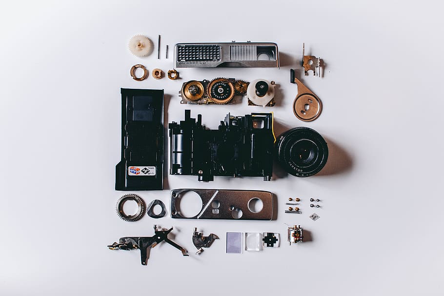 Flat Lay Photography of Black and Gray Components on White Surface HD wallpaper