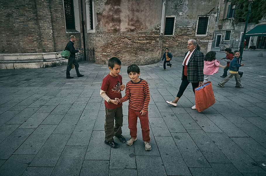 Two boys standing. Stand boy 2.