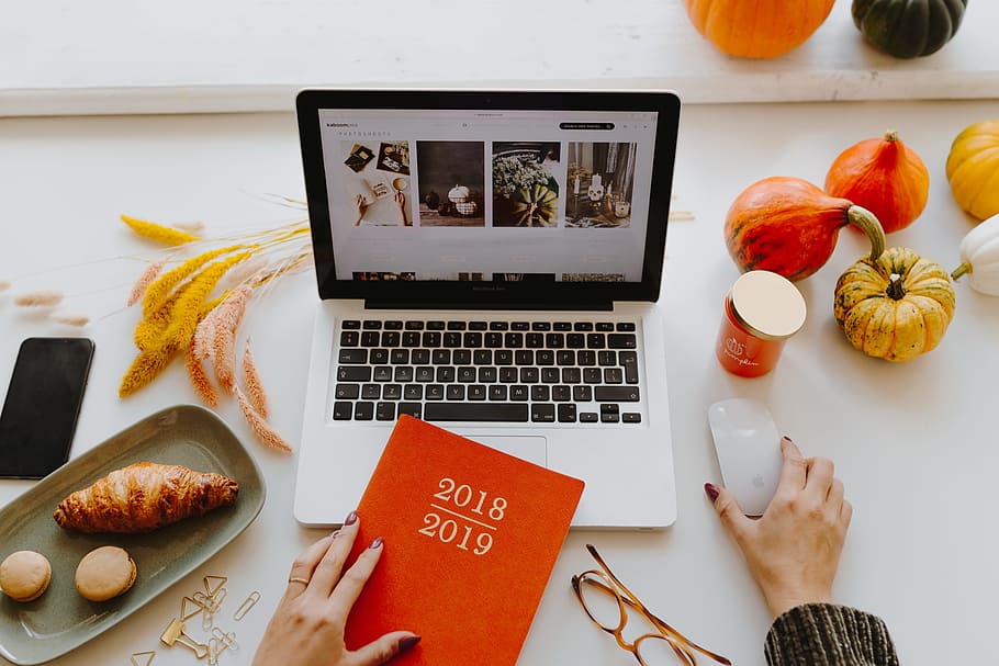 Female desk with orange notebook and pumpkins, laptop, computer HD wallpaper