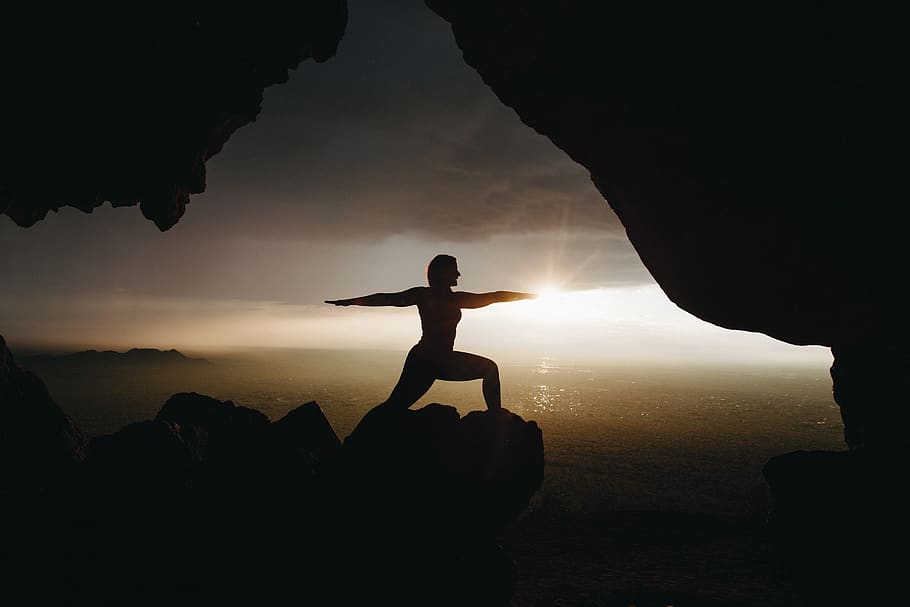 people, silhouette, man, guy, ocean, rock, formation, clouds HD wallpaper