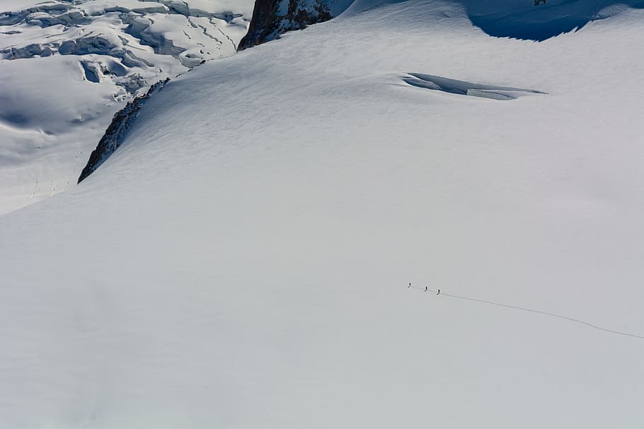 snow-covered field, mountain, person, winter, cold, trek, hike HD wallpaper