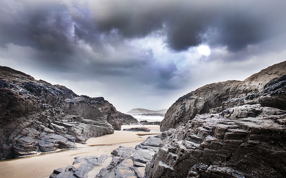 Gray Rock Formation Under Clouds at Daytime, beach, cliffs, cloudy sky HD wallpaper