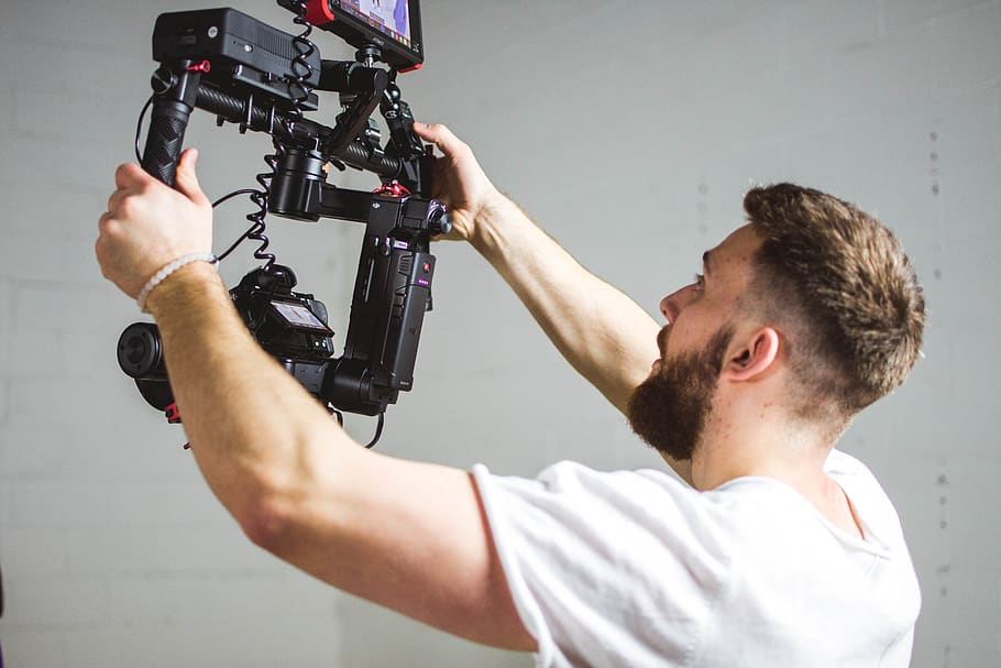 man holding camera with stabilizer, person, human, people, photographer HD wallpaper