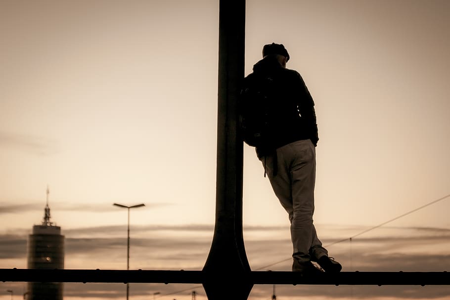 man, silhouette, view, sunset, romance, person, sky, dusk, street art HD wallpaper