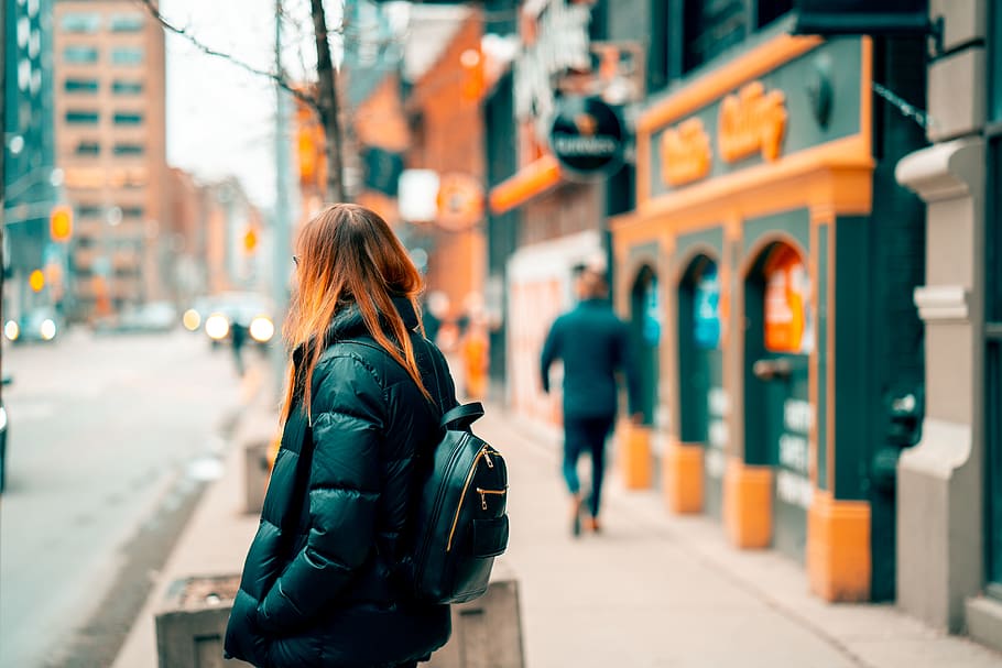 Woman Standing Beside Road, architecture, backpack, blur, city HD wallpaper