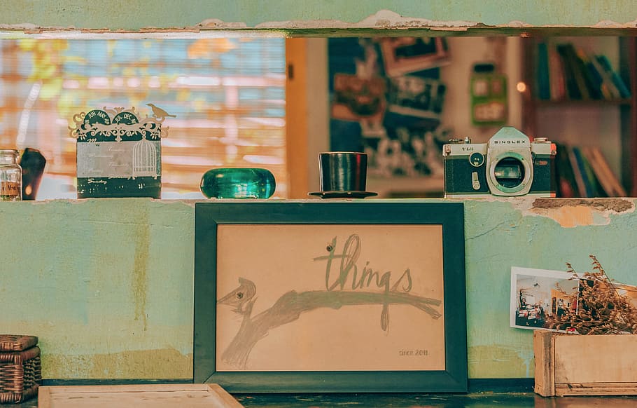 Camera on Top of Shelf Near Photo Frame, architecture, art, design HD wallpaper
