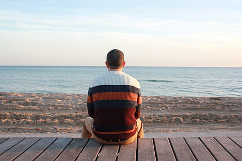 Man Sitting on Wooden Panel Facing in the Ocean, back view, beach HD wallpaper