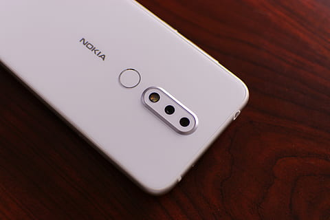 white Nokia smartphone on brown surface, cell phone, mobile phone HD wallpaper