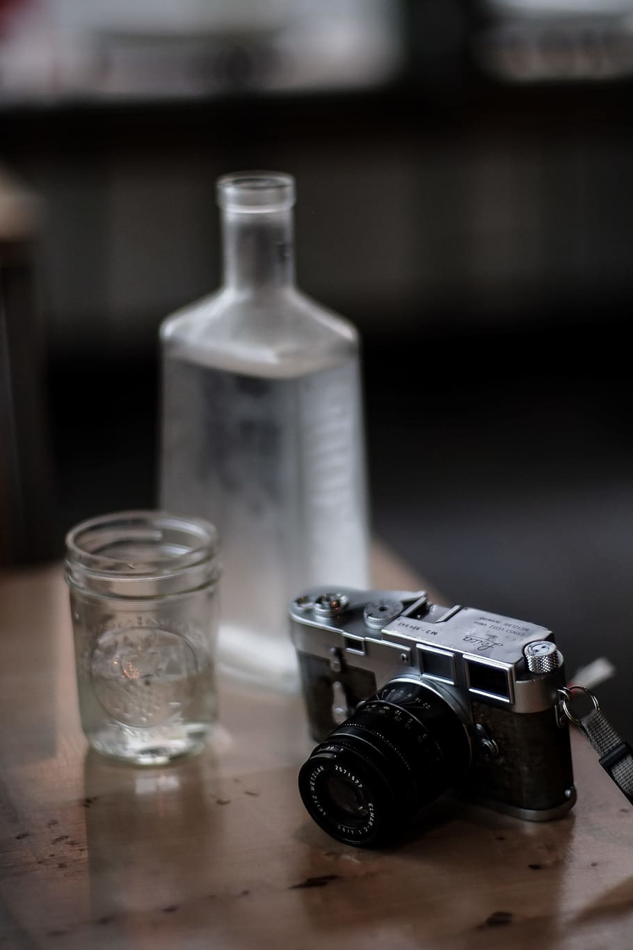 Black and Gray Camera Beside Drinking Glass, blurred background HD wallpaper