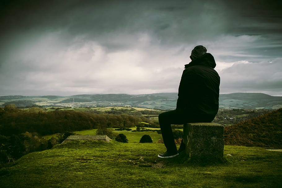 Man in Black Jacket Sitting on Block, adventure, calm, clouds HD wallpaper