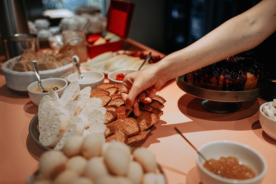 person picking brown breads, food and drink, human hand, one person HD wallpaper