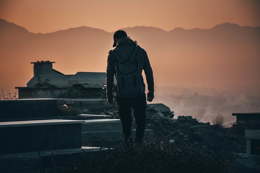 Man Standing on Building Ruins, back view, backlit, backpack HD wallpaper