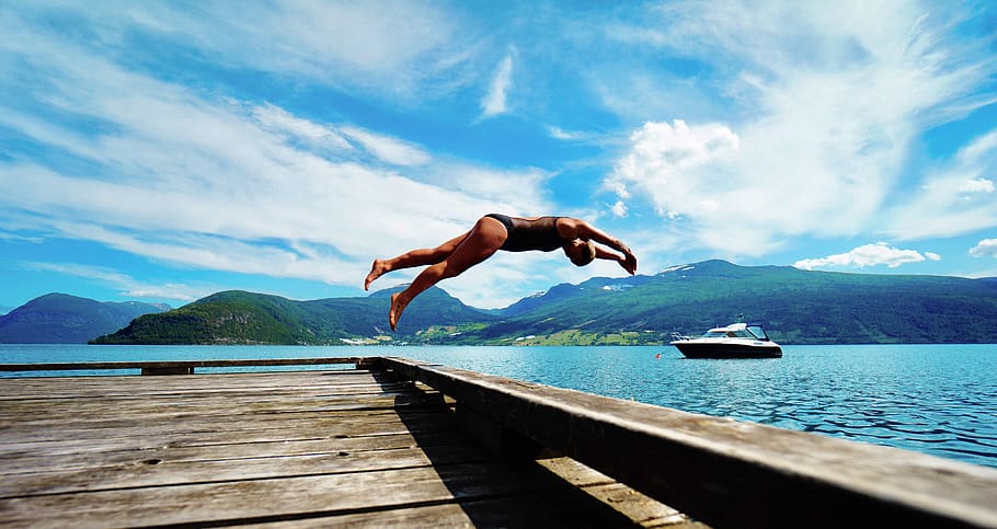 person jumping on body of water at daytime, diver, diving, human