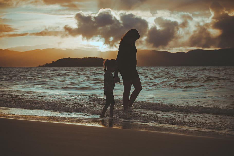 Silhouette Of Woman And Girl Walking On Seashore, backlit, beach HD wallpaper