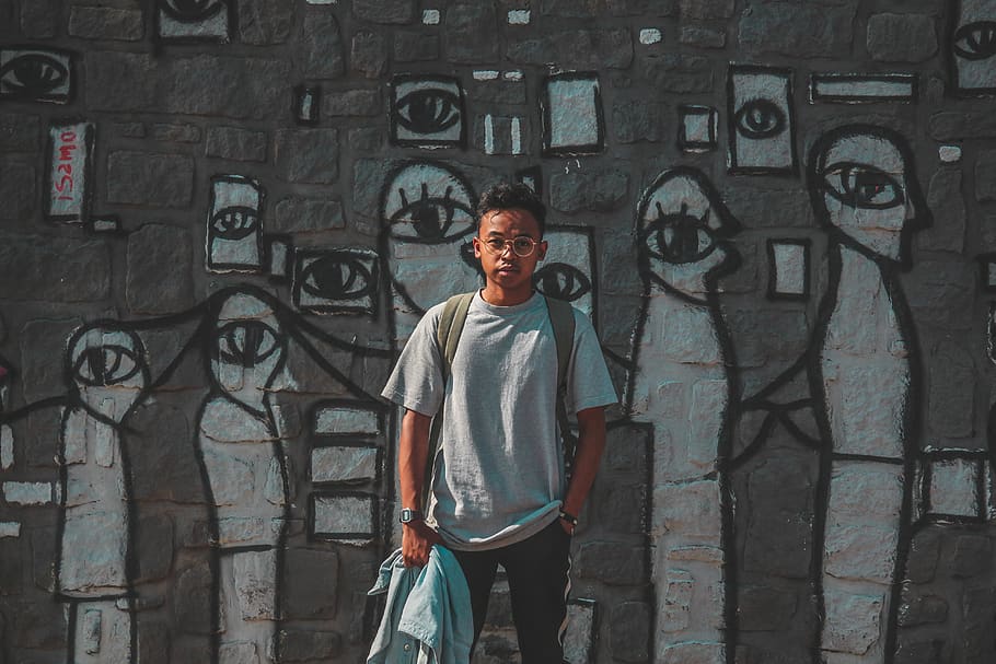 Man in Gray T-shirt Holding Jacket, boy, colors, daylight, eyewear HD wallpaper