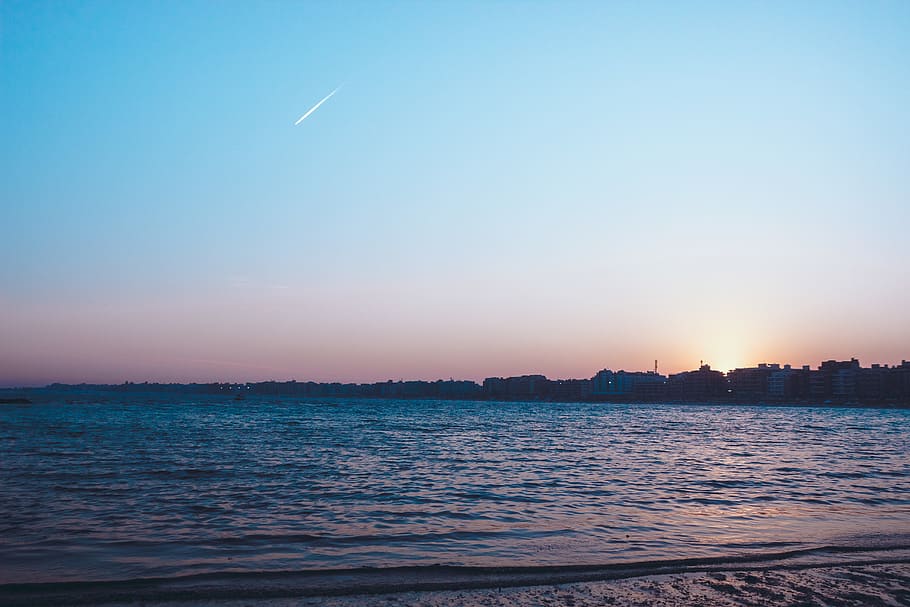 Ocean Under Blue Sky, backlit, beach, brazil, buildings, dawn HD wallpaper