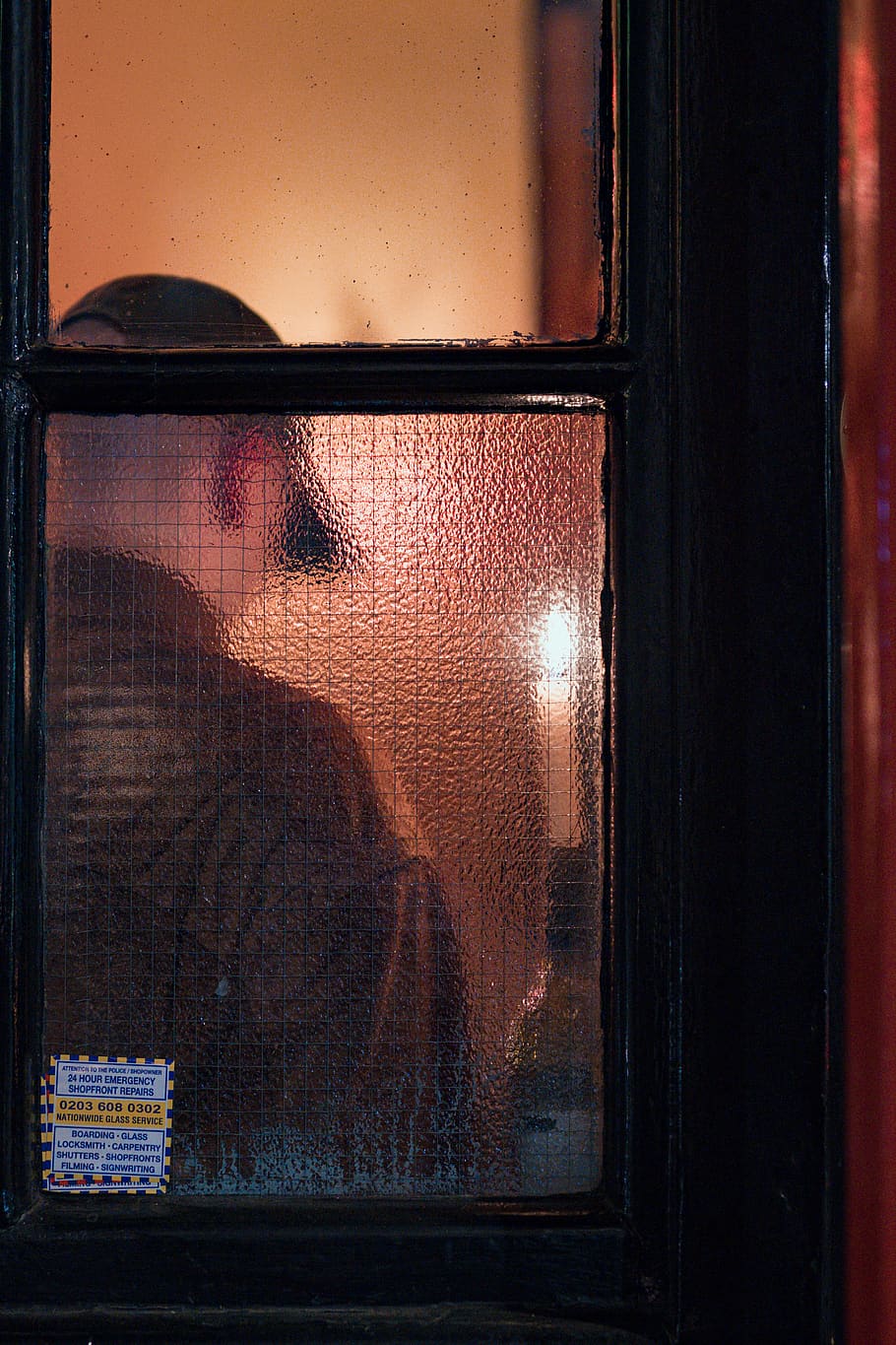 man standing beside black framed glass door, home decor, window