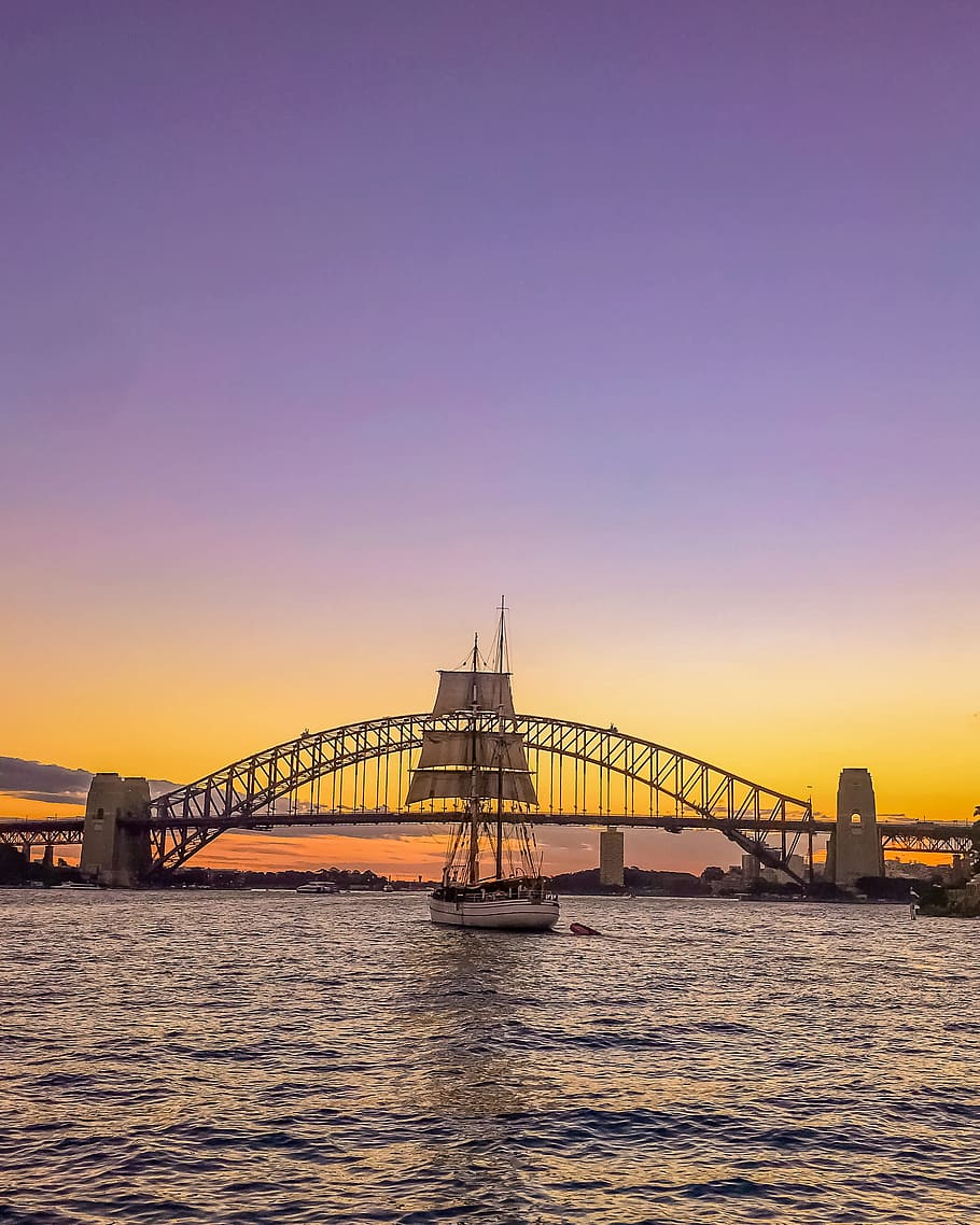 Sail Boat in Front of Bridge Under Orange Sunset, architecture HD wallpaper