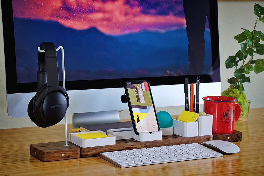 smartphone beside black headphones and red ceramic mug, workspace HD wallpaper