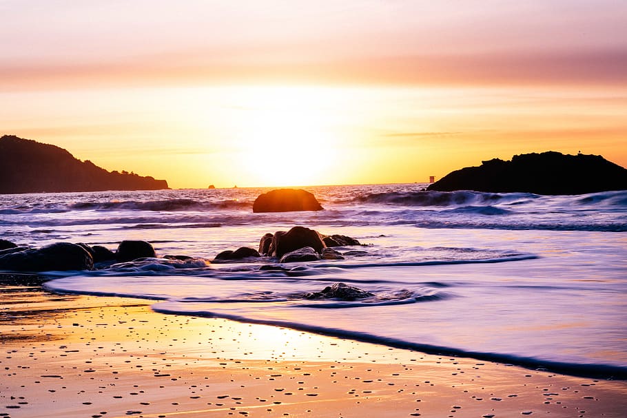 sunset over horizon, sea, water, sky, beach, beauty in nature HD wallpaper