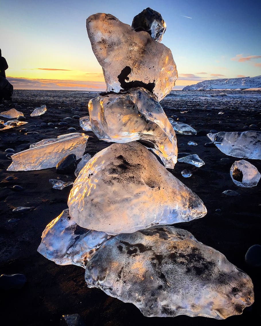 Close Up Photo of Ice Stone on the Ground, beach, boulders, clouds HD wallpaper