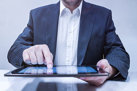Businessman working on his tablet in the office, technology, wireless technology HD wallpaper