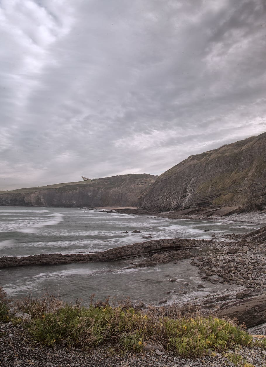 clouds, beach, cliffs, rocks, stones, water, cloud - sky, beauty in nature HD wallpaper