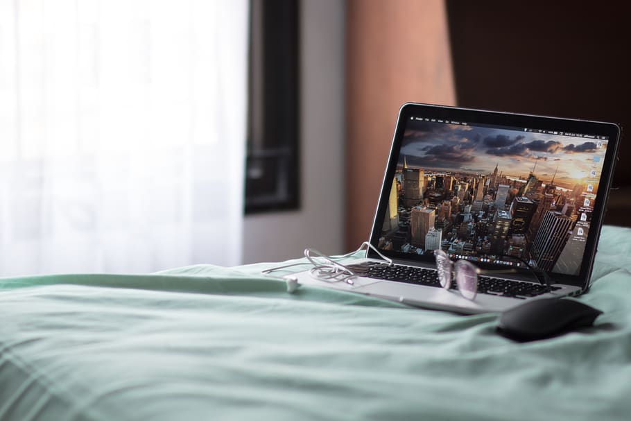 turned-on MacBook Pro on bed, technology, communication, wireless technology HD wallpaper