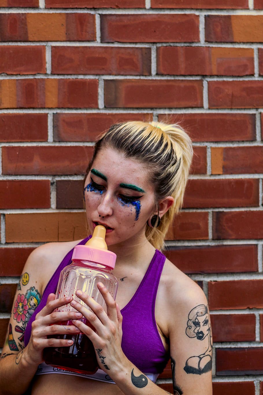 Woman Placing Feeding Bottle on Her Lips, art, brickwall, color, HD wallpaper