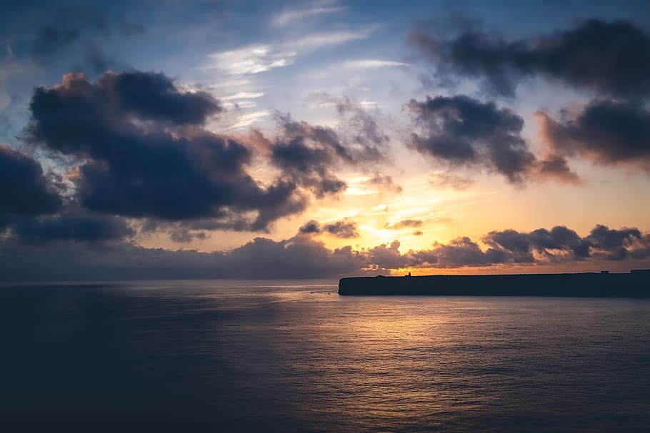 sunset, horizon, lighthouse, landscape, sky, dawn, orange, water HD wallpaper