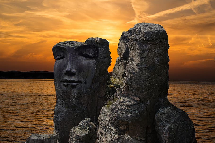 rock, rock face, fantasy, stone face, sunset, dusk, sky, waters HD wallpaper