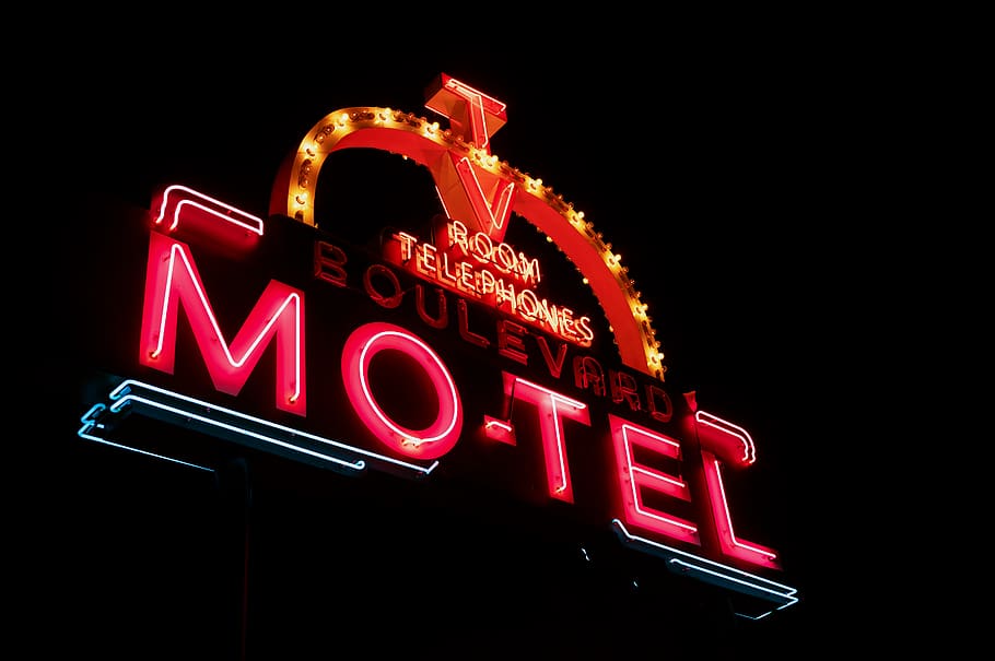 Photo of Red and Orange Motel Neon Signage, bright, close-up