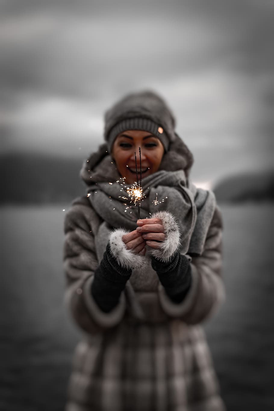Photo of Smiling Woman in Winter Clothing Holding Sparklers, beanie HD wallpaper